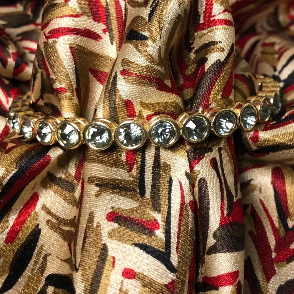 Heavy gold tone Grey Rhinestone bangle bracelet